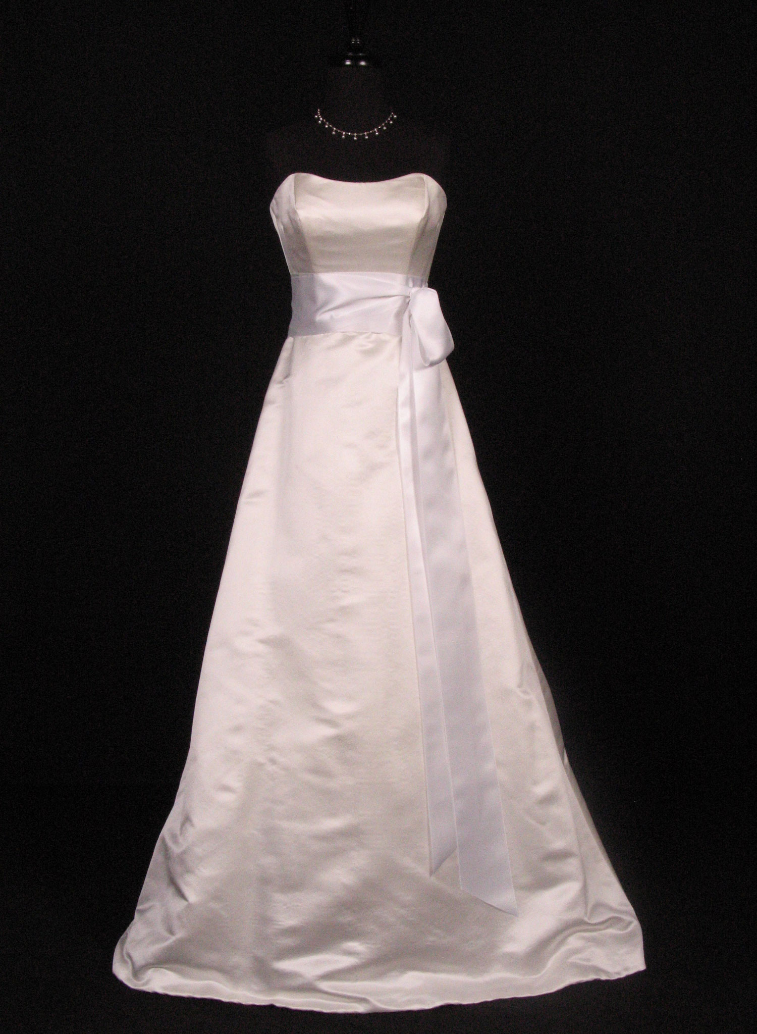 Wedding dress with a white satin ribbon sash