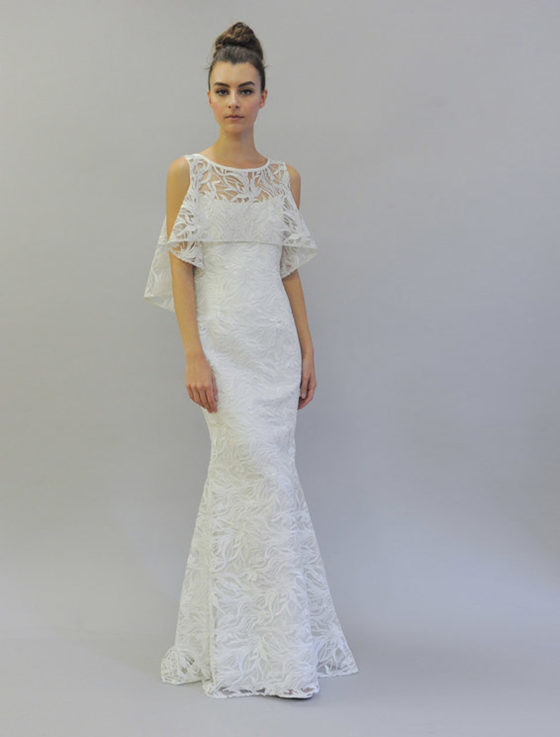 This beautiful Austin Scarlett Scarlett Collection Nadine E017 wedding dress is Brand New and has its hang tag attached!  The gown has two looks in one!  You can wear the removable cape or you can simply wear the spaghetti strap gown without the cape.  The trumpet silhouette flows into a short sweep train.  Gorgeous branch lace makes this Austin Scarlett wedding dress such a couture creation!
