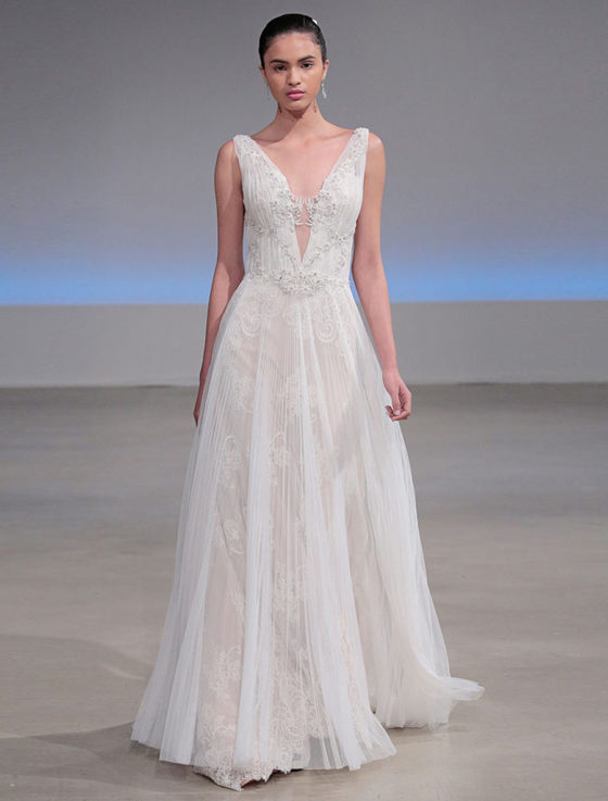 This gorgeous Isabelle Armstrong Willow wedding dress is Brand New!  This wedding gown is truly a work of art!!  You will be in awe when you see how incredible this gown is in person.  It is made from luxurious French Alencon Lace with an overlay of English Net and beading on the bodice.  The outer fabrics are silk white (diamond white) and the lining is a nude color.  The sleeveless v-neck and v-back bodices flow into an a-line silhouette with a chapel train.