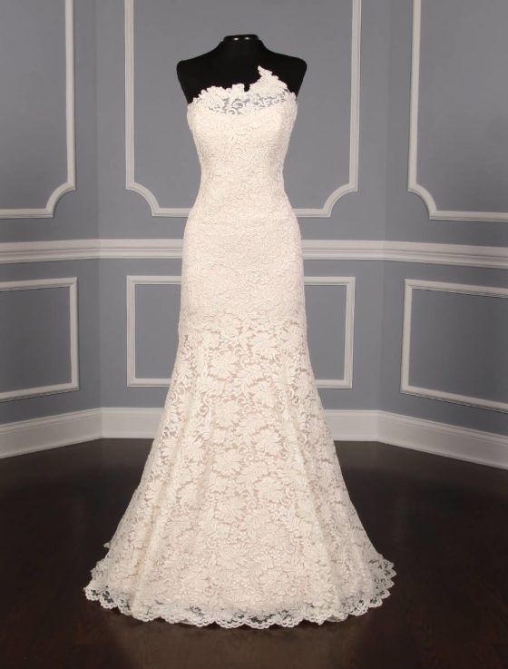 This elegant, lace Romona Keveza Legends L7131 wedding dress is Brand New!  Soft blush lining gives this gown the perfect touch of soft pink color.  The French Alencon lace is gorgeous and creates an asymmetrical, strapless neckline.  A trumpet silhouette flows into a sweep train.  You will be able to move and dance easily in this Romona Keveva wedding dress.
