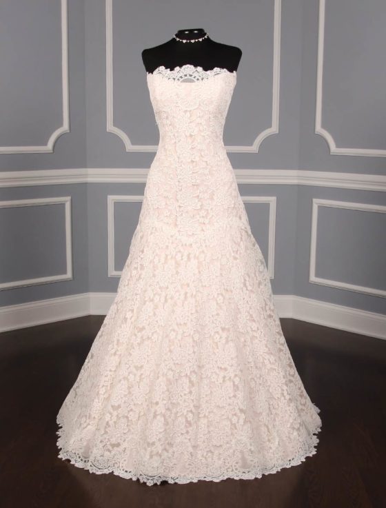 This lace Romona Keveza Legends L503 wedding dress is Brand New!  The gown has ivory re-embroidered lace and blush lining.  Such an elegant color combination!  This Romona Keveza strapless wedding gown has a scalloped neckline and hem, an a-line silhouette and a chapel train.