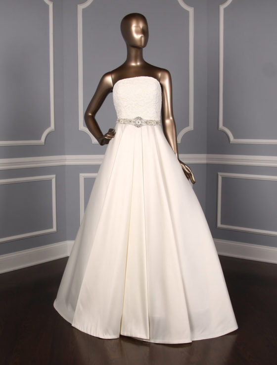 This Sachin & Babi Emma BS1710 X wedding dress is such a classic and timeless style! The ivory corded floral lace and Italian stretch jacquard are both so incredible in person. Perfect for any type of wedding venue! This a-line wedding dress is strapless with a sweep train. The Justina Atelier embellished sash shown in the photos is not included with this gown. Please visit our Accessories section to see our large selection of embellished and non-embellished sashes.