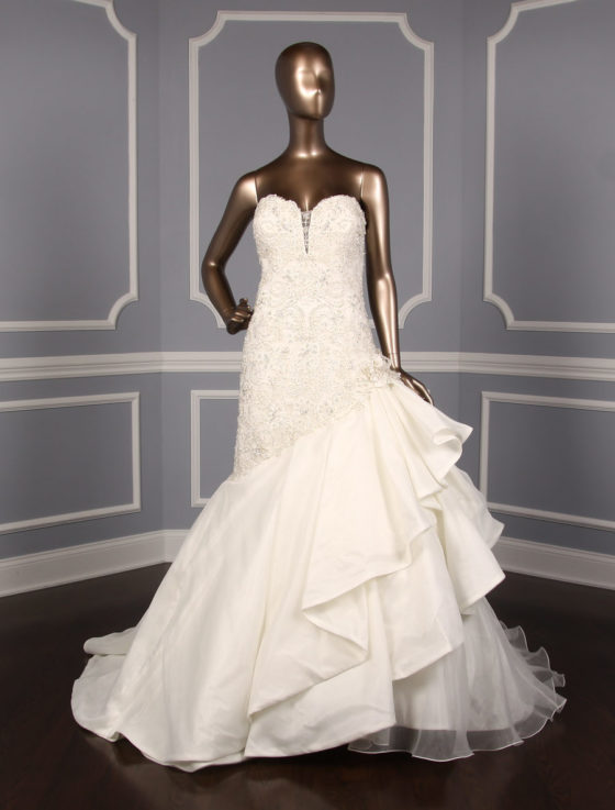 This David Tutera 115230 wedding dress is Brand New and has its David Tutera hang tag attached! The gown is made from beautiful embellished lace and organza. This lace wedding dress is strapless with a sweetheart neckline, a fit and flare silhouette and a chapel train. You will look amazing as you walk down the aisle in this gorgeous David Tutera wedding gown!