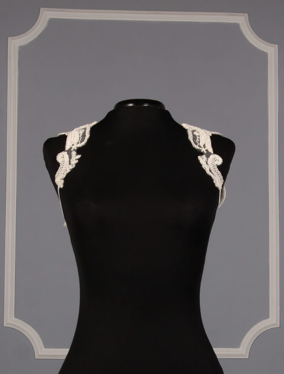 This beautiful Vera Wang 11A4016B bolero jacket is Brand New!  The bolero jacket is made from gorgeous embroidered tulle.  This sleeveless bolero is a perfect compliment to any light ivory, or ivory, wedding gown or formal dress.