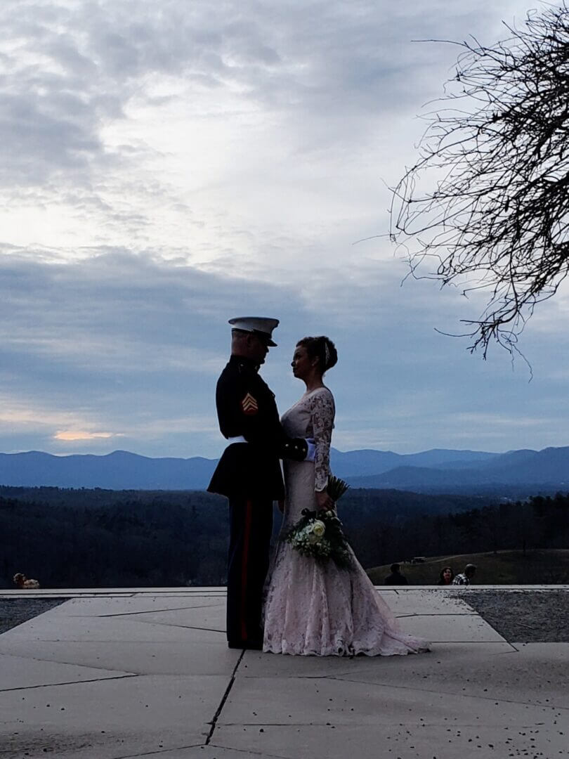 Couple on a mountain overlook at their wedding